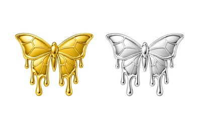 Two butterfly-shaped jewelry pieces on a plain white background, one in polished gold and one in polished silver, both with a dripping wax or melting effect along the lower edges.